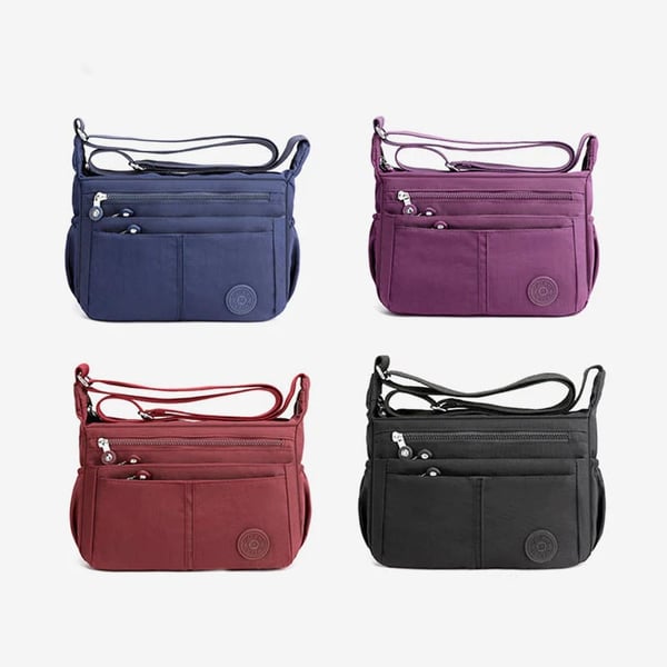 Bolso bandolera informal impermeable de gran capacidad y múltiples bolsillos.
