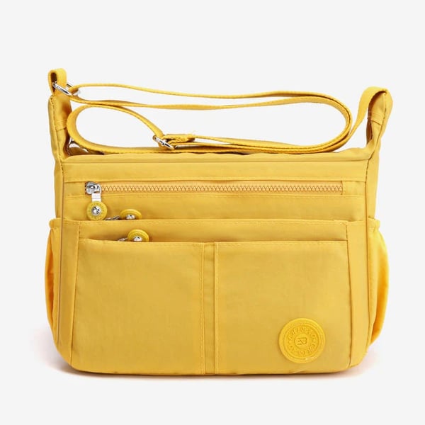 Bolso bandolera informal impermeable de gran capacidad y múltiples bolsillos.