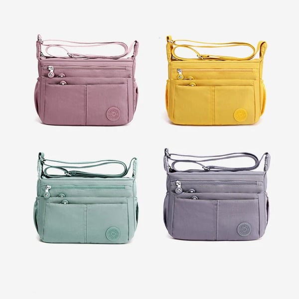 Bolso bandolera informal impermeable de gran capacidad y múltiples bolsillos.